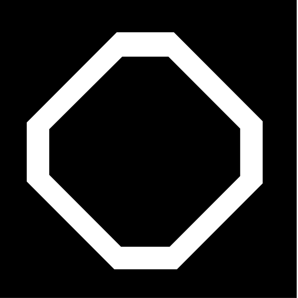 The image shows a black hexagon with white lines forming its shape against an indistinct background on the left side of the frame.