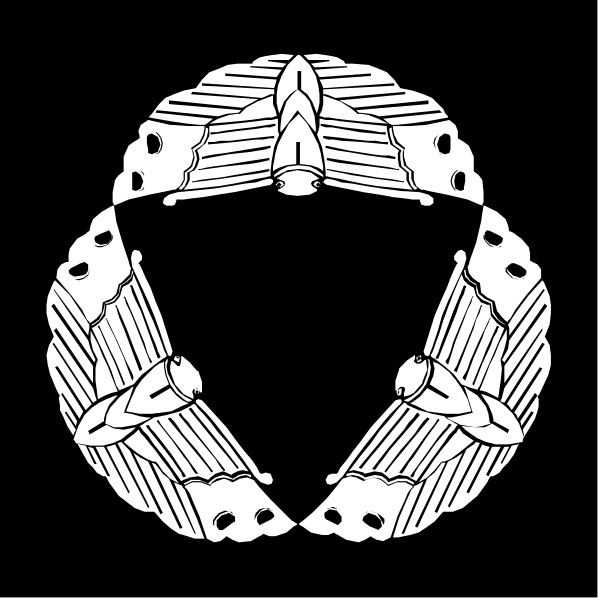 The black and white logo of a fraternal organization with an emblem that includes wings on either side forming a circle around what appears to be a shield-like design in the center.