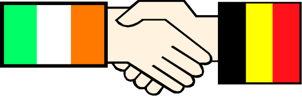 The image shows two hands holding each other over a colorful ribbon with flags on it against an indistinct background that appears to be grayish-brown in tone.