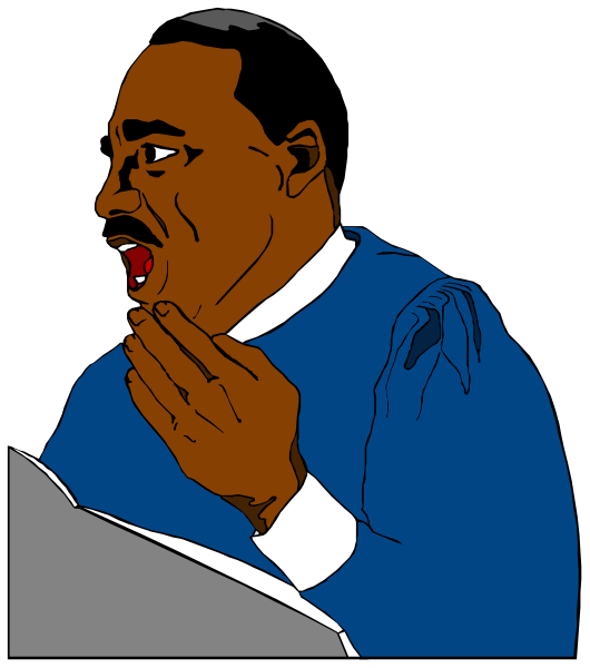 The image shows a black and white illustration of Martin Luther King Jr., depicted with his mouth open as if speaking passionately while wearing a suit jacket over an undershirt. He is standing in front of what appears to be a podium, suggesting he might be giving a speech or presentation at the time this photo was taken. The background features a simple black and white pattern that does not provide any additional context about location or setting beyond being indoors with some sort of decorative wallpaper behind him.