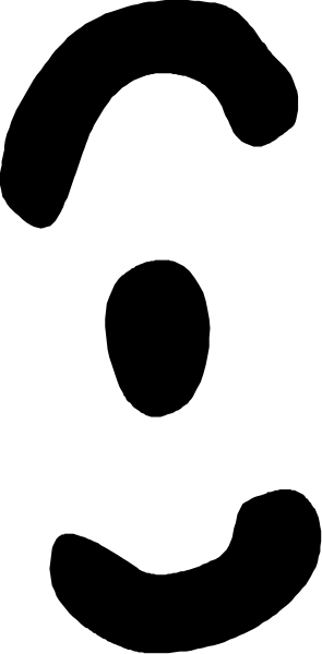 The image shows a black and white photo of an object with multiple lines on it against a blurred background that appears to be indoors due to the presence of what looks like furniture in the distance.