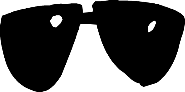 The image shows a black cat sitting on top of an object with two white spots next to it.
