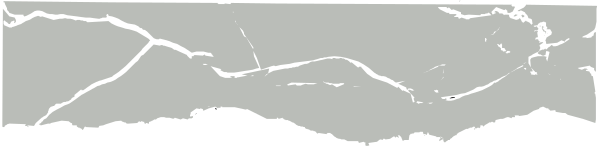 The image shows a black and white photo of an object with cracks on it against a dark background.