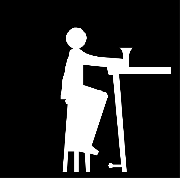 The black and white silhouette of a person sitting at an elevated table with their legs crossed over each other while holding what appears to be a cup in one hand and possibly writing on paper held by another, all set against a dark background.