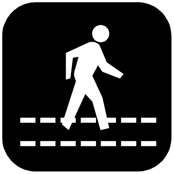 The black silhouette of a person walking on sidewalk with white lines indicating pathway boundaries.