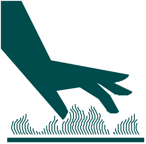The image shows a stylized graphic of an arm reaching out towards some grass with trees behind it; there is no text present in this clip-art illustration.