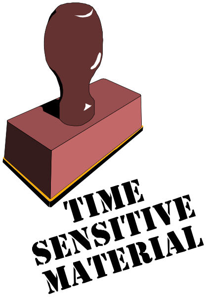 The image shows a red brick with an object on top of it against a black background.