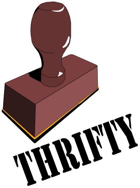 The image shows a red lever handle on top of a wooden block with two visible sides against a black background.