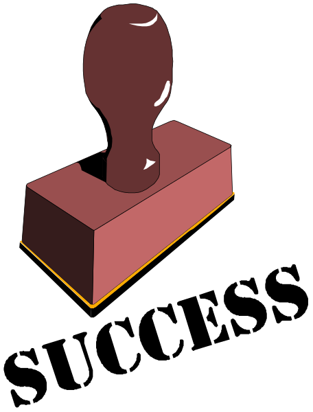 The image shows a red brick with an object on top of it that resembles a bottle opener.