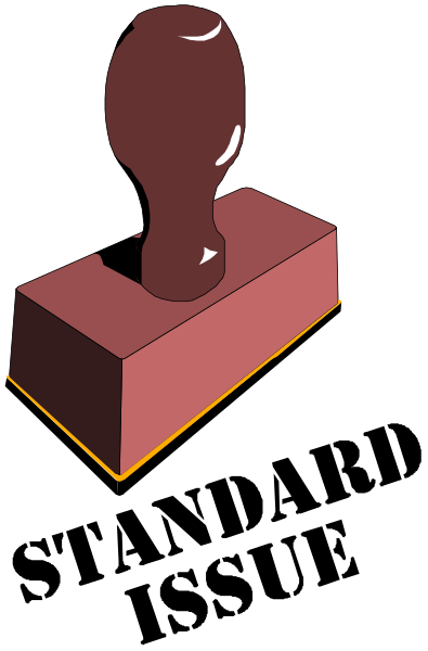 The image shows a red brick with an embedded metal object that resembles a keyhole cover on its side against a black background.