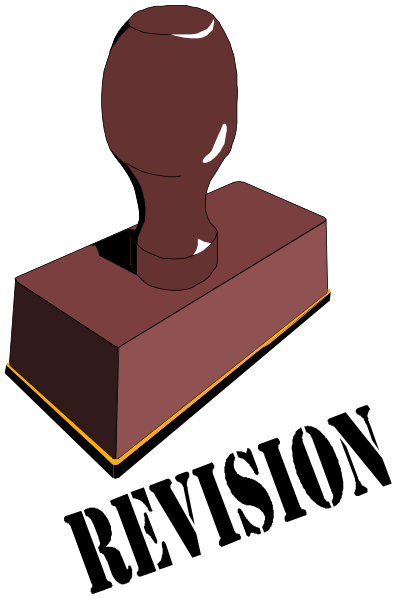 The image shows a red lever handle on top of an object that appears to be made from wood with visible grain patterns.