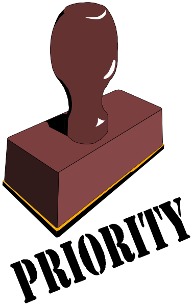 The image shows a red brick with an orange mortar joint on its side against a black background.