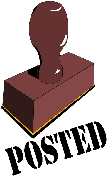 The image shows a red block with an indentation on top of it to resemble a button being pushed down by another object that is partially visible in front of it; this second object appears to be made from wood and has two protruding parts, one at each end, which are not fully shown.