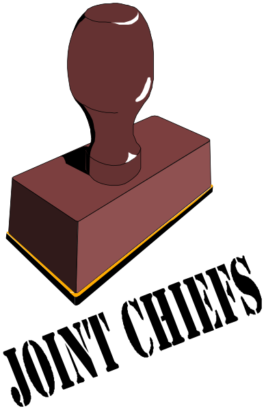 The image shows a red ink stamp with an imprinted handle on it placed inside of what appears to be a wooden block frame.