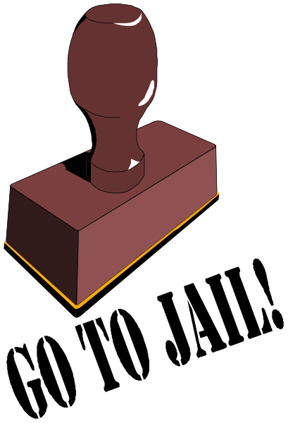 The image shows a red wooden block with an engraved handle on top of it against a black background.