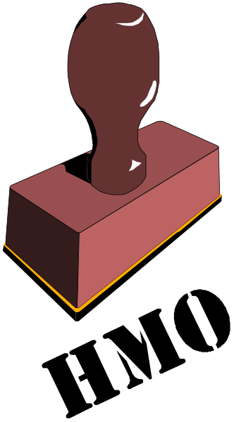 The image shows a red brick with an object on top of it that resembles a person's head from behind, set against a black background.