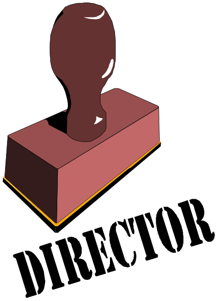 The image shows a red brick with an embedded metal object that resembles a keyhole cover on its surface against a black background.