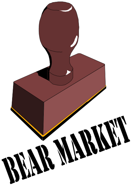 The image shows a red wooden block with an engraved handle on top of it against a black background.