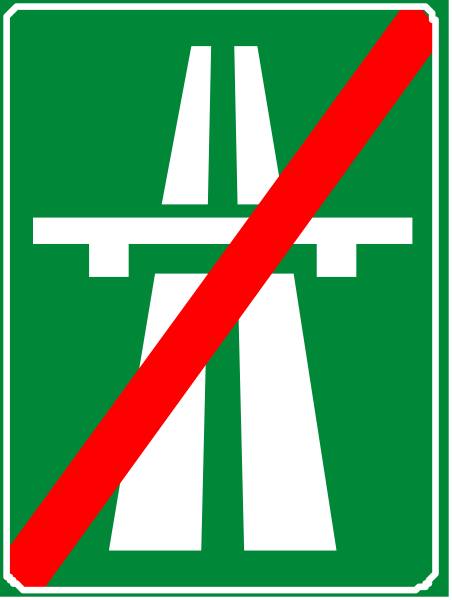 The sign indicates a prohibition against motor vehicles on that roadway with an accompanying red circle symbolizing "do not enter" for all traffic except pedestrians.