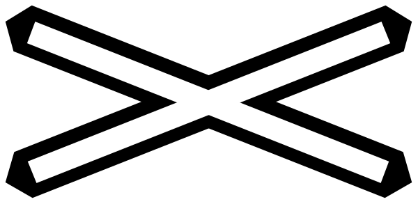 The image shows a black cross with white lines on it against a grey background.