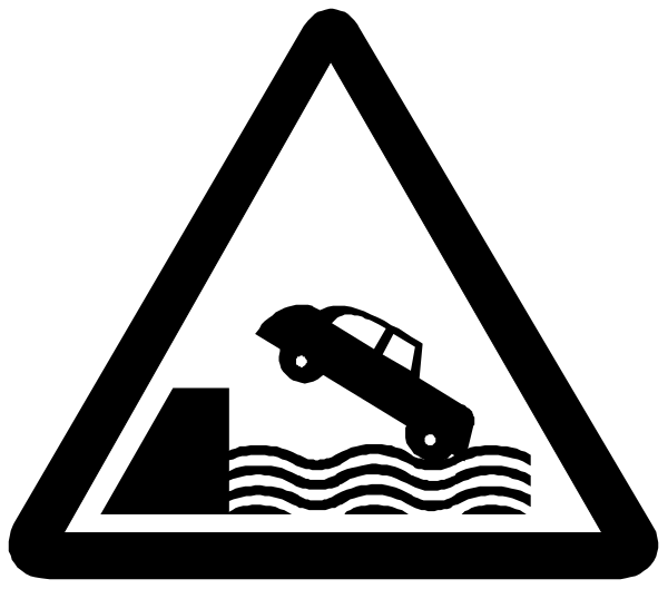 The image shows a warning sign with an icon of a car driving into water next to a symbol representing flood waters.