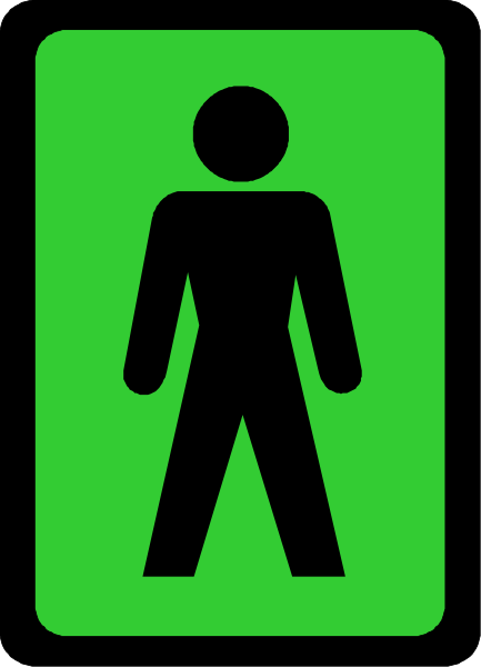 The image shows a green exit sign with an icon of a person walking to its right side.