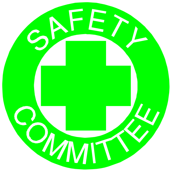 The image shows two circular stickers with a green cross symbolizing first aid on them placed next to each other against a black background.
