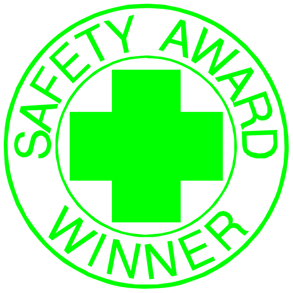 The image shows two circular badges with a green cross symbolizing first aid on them against a black background; each has text that reads "SAFETY AWARD WINNER" in white capital letters, and below it is an additional line of smaller print stating "FIRST PLACE."