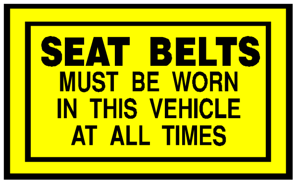 The picture shows a sign that says "SEAT BELTS MUST BE WORN IN THIS VEHICLE AT ALL TIMES."