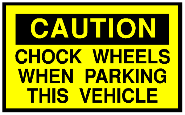 The image shows a caution sign with text that reads "CAUTION CHECK WHEELS WHEN PARKING THIS VEHICLE."