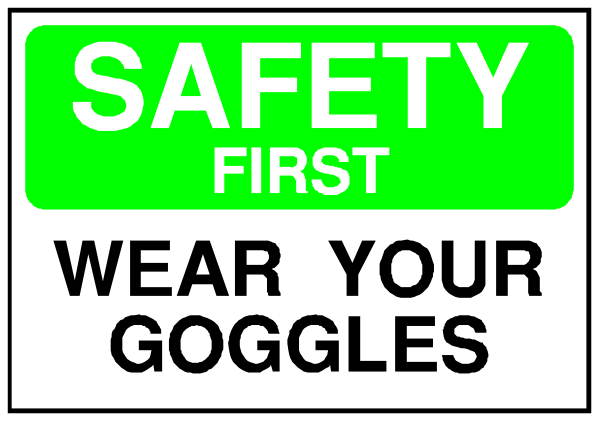 The image shows a sign with text that reads "SAFETY FIRST" at top followed by instructions to wear goggles below it.