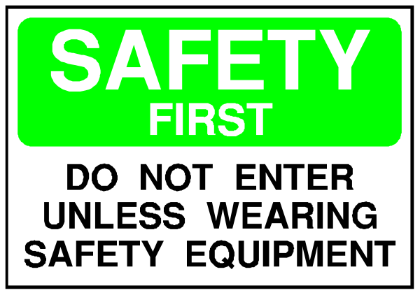 The image shows a sign with text that reads "SAFETY FIRST" at top followed by instructions: "DO NOT ENTER UNLESS WEARING SAFETY EQUIPMENT."