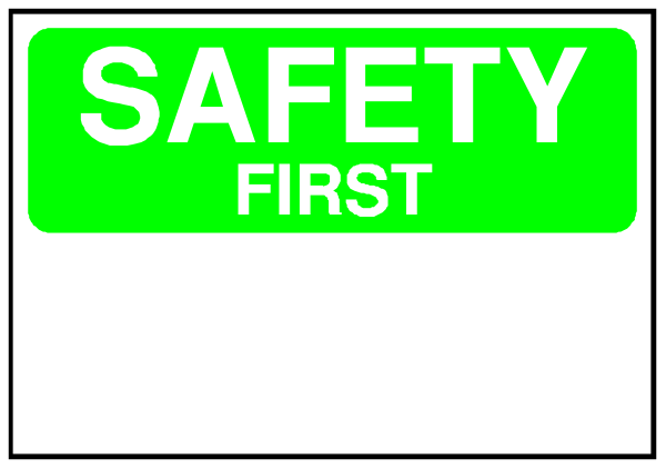 The image shows a sign with "SAFETY FIRST" written on it against an orange background inside what appears to be a white border.