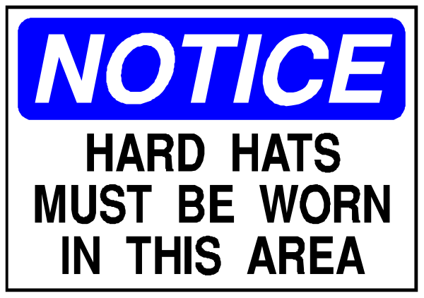 The image shows a notice with text that reads "NOTICE HARD HATS MUST BE WORN IN THIS AREA."