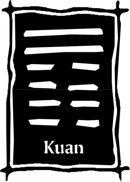 The black and white photo shows a logo with Chinese characters that read "Kuan" on it.
