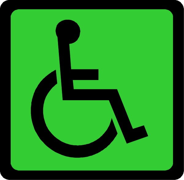 The image shows a green handicap sign with an icon of a wheelchair on it against a black background.