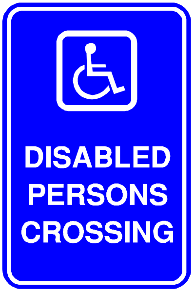 The sign says "disabled persons crossing" with a wheelchair symbol above it on top of blue background.