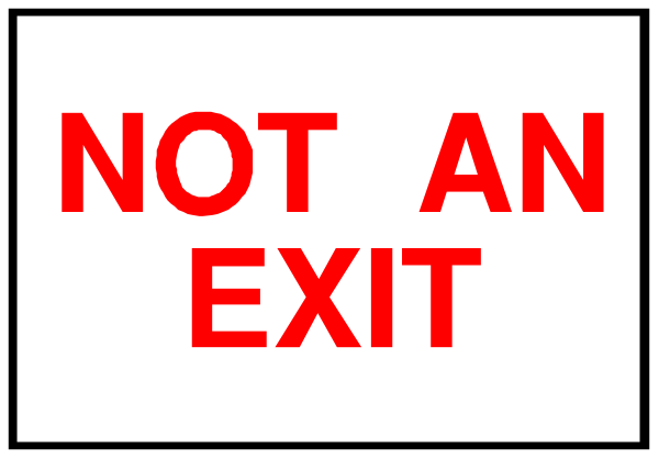 The image shows a sign with red text that reads "NOT AN EXIT" on it placed inside an exit door frame in what appears to be a room.
