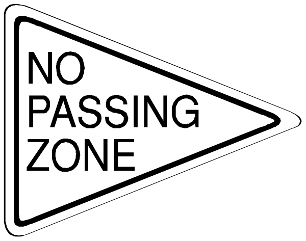 The image shows a black and white sign with text that reads "NO PASSING ZONE" on it.