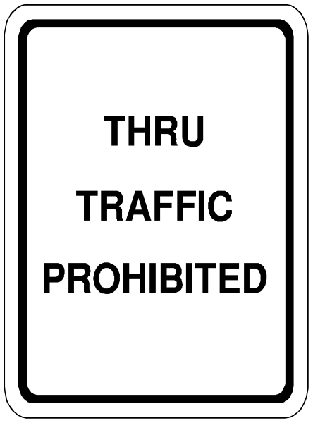 The image shows a sign with text that reads "THRU TRAFFIC PROHIBITED" on it.