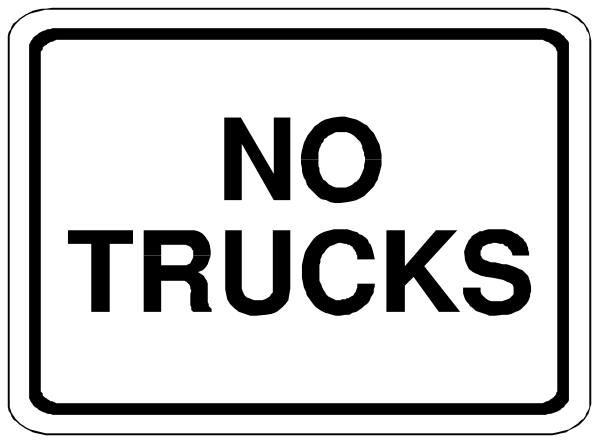 The black and white sign says "NO TRUCKS."