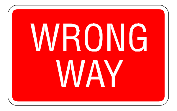 The image shows a red street sign with white lettering that reads "WRONG WAY" on it.