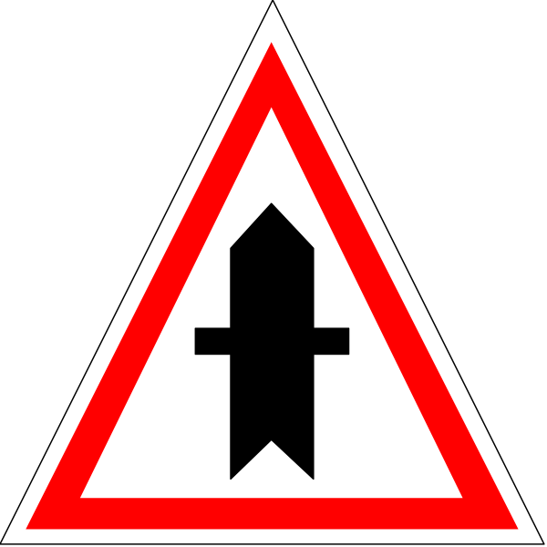 The image shows a red triangle with an exclamation mark inside it on top of what appears to be a black background.