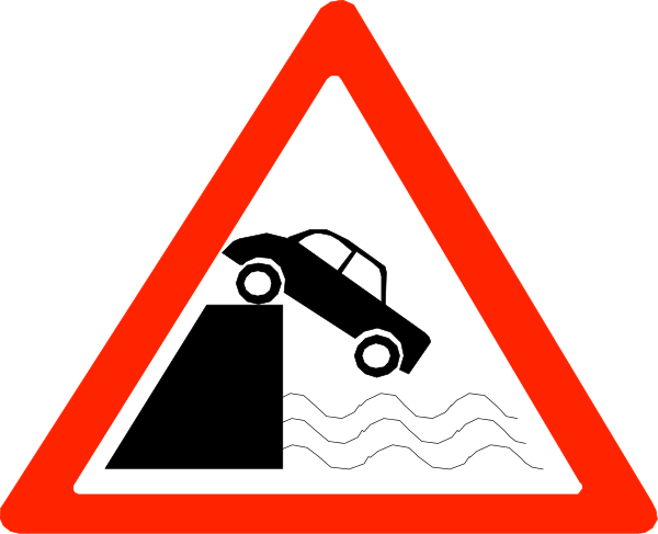 The sign shows a car driving off of an edge with waves below it on either side.