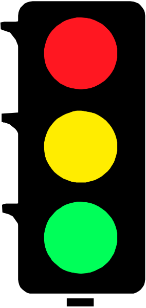 The image shows a traffic light with three colored lights: red on top left, yellow at bottom right, green below it in center of frame.