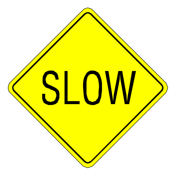 The image shows a yellow diamond sign with black text that reads "SLOW."