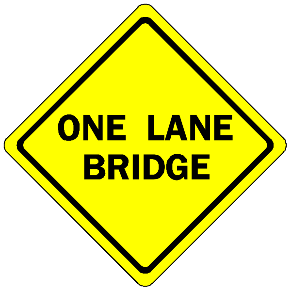 The image shows a yellow diamond sign with black text that reads "ONE LANE BRIDGE" on top of another smaller white rectangle sign below it also reading "ONE LANE BRIDGE."