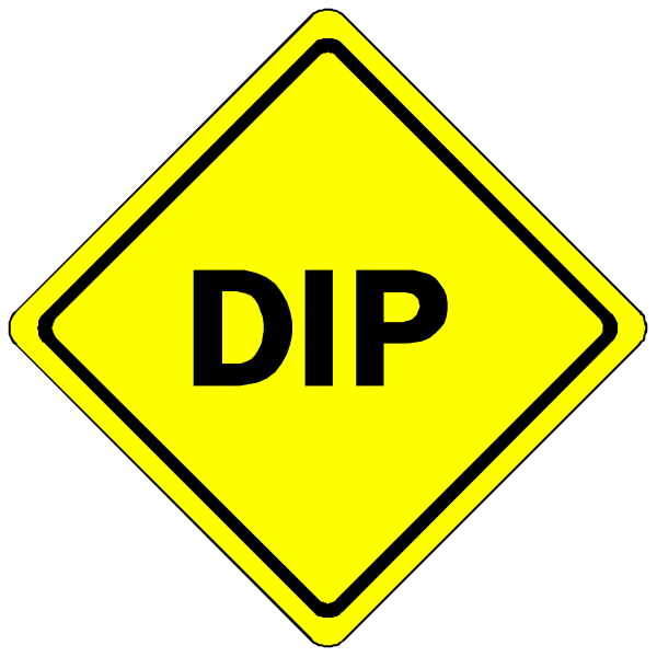 The image shows a yellow diamond sign with black text that reads "DIP" on it against a dark background.