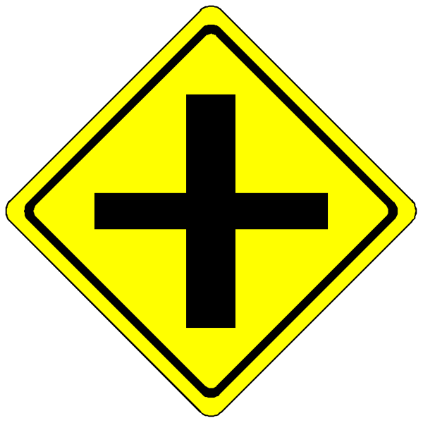 The image shows a yellow road sign with an "X" symbol on it next to another similar sign that has been crossed out by two diagonal lines forming an 'x'.