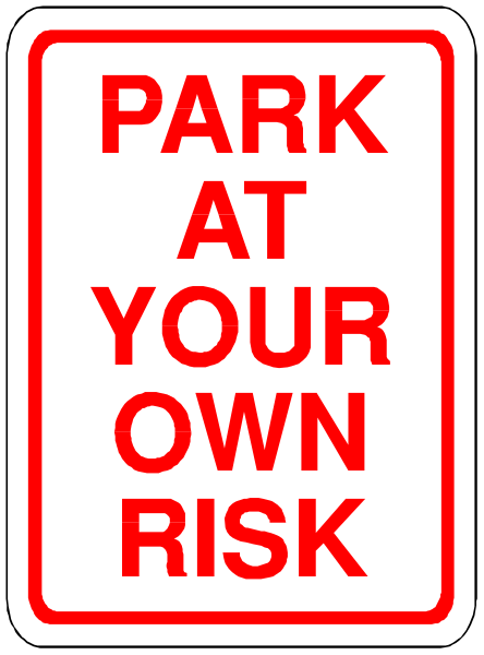 The image shows a red sign with white text that reads "PARK AT YOUR OWN RISK" on top of another smaller sign below it which says "YOUR OWN".